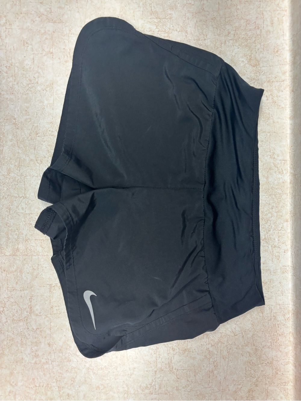 Nike women’s Black Athletic Shorts with Silver Swoosh